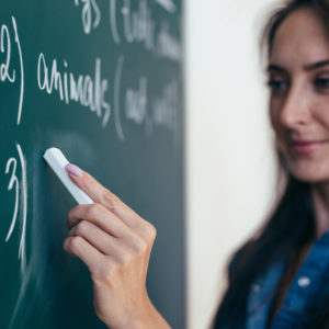 teacher at the chalkboard
