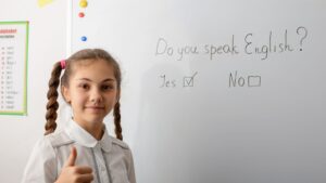 girl standing in front of white board