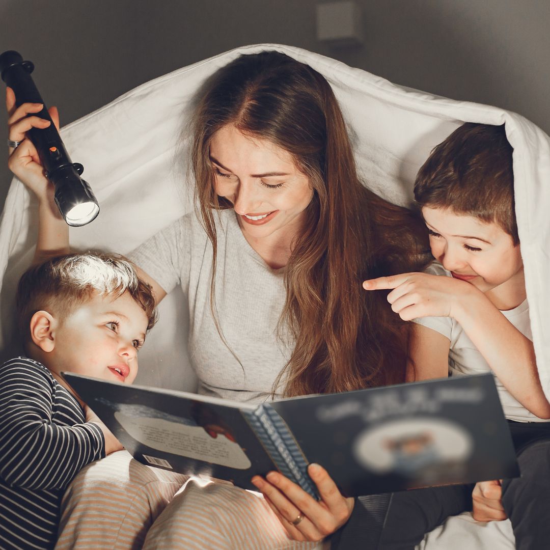 mom and sons reading together