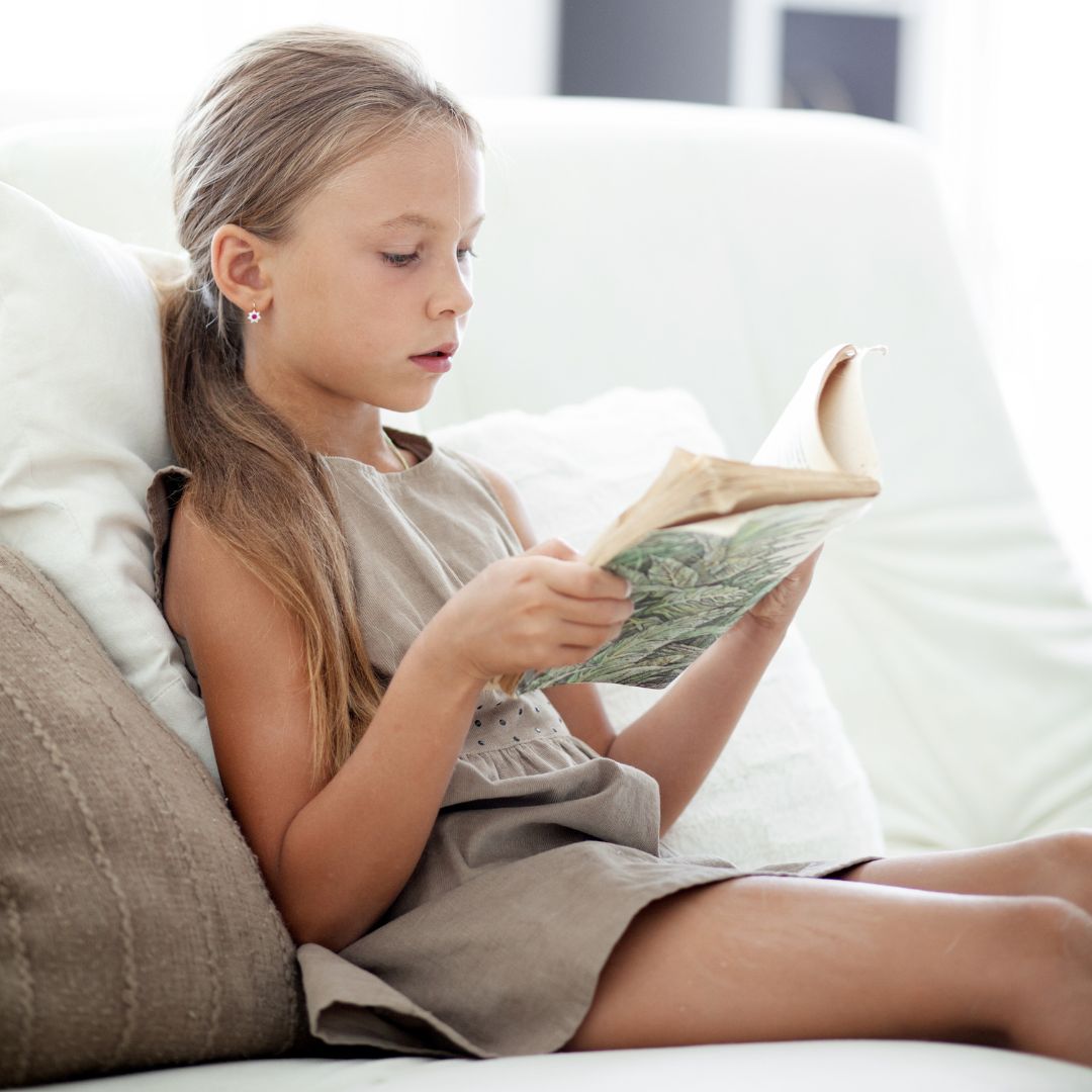 young girl reading independently