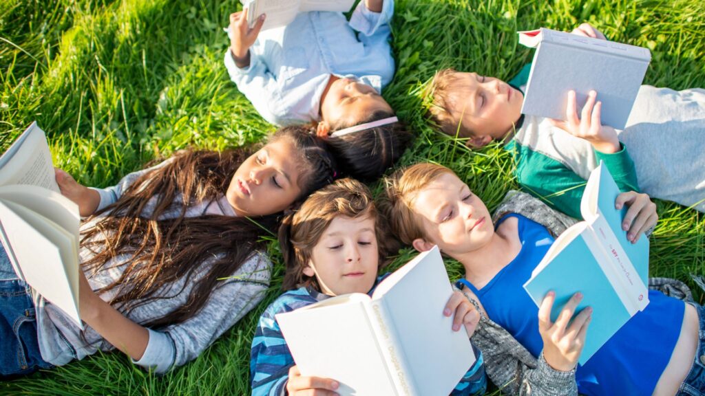 children reading outside